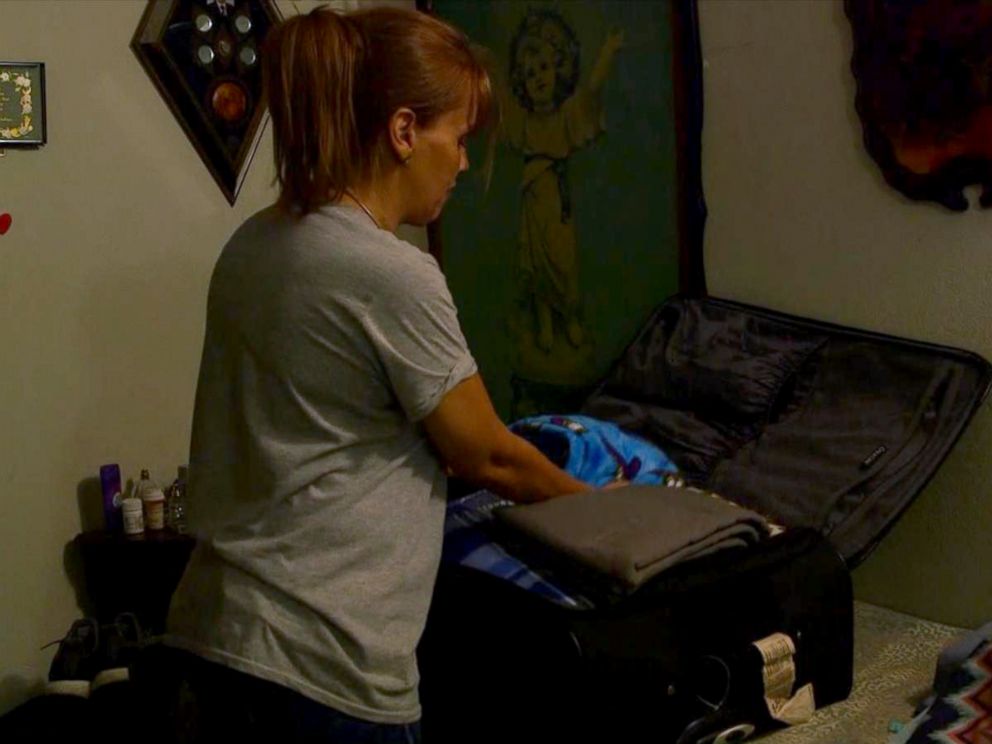 PHOTO: Lisbeth Vasquez packs her luggage in Puerto Rico. She told ABC News that her parents apartment building has just gotten power back after more than 40 days but still had dirty water.