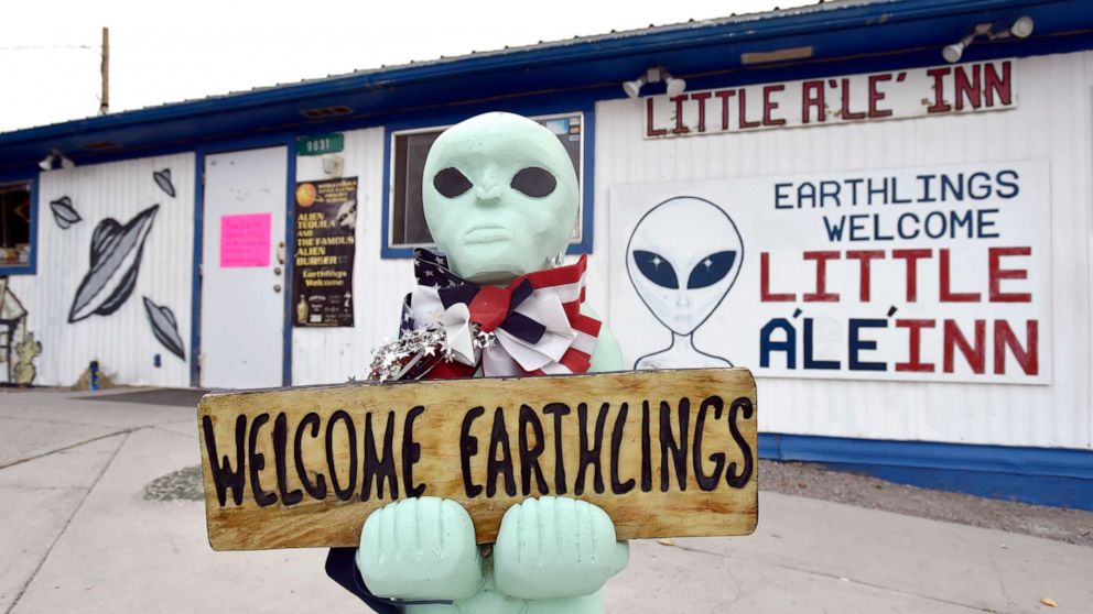 PHOTO: An alien-like statue displays a sign welcoming guests to the Little A'le' Inn restaurant and gift shop, July 22, 2019, in Rachel, Nevada.