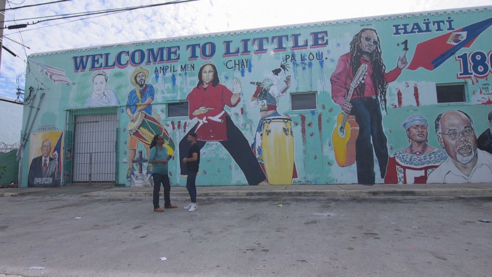 PHOTO: Viter Juste, Carl’s father, is immortalized in an immense mural  – honoring him as one of the founding fathers of the neighborhood.