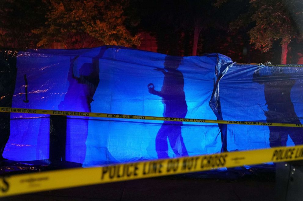 PHOTO: Police put up a blue tarp to block the view of a body at the scene of an officer involved shooting  in Richfield, Minn., Saturday night, Sept. 7, 2019.