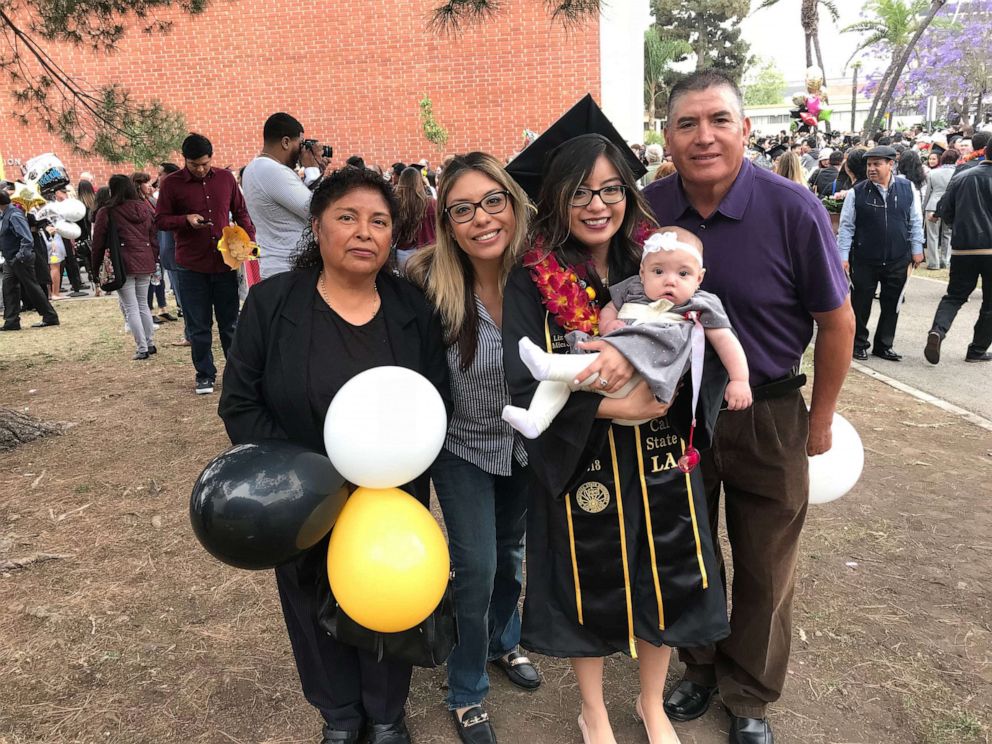 PHOTO: Lizbeth Sanchez Olivera is seen with her family during her graduation ceremony at California State University, Los Angeles.