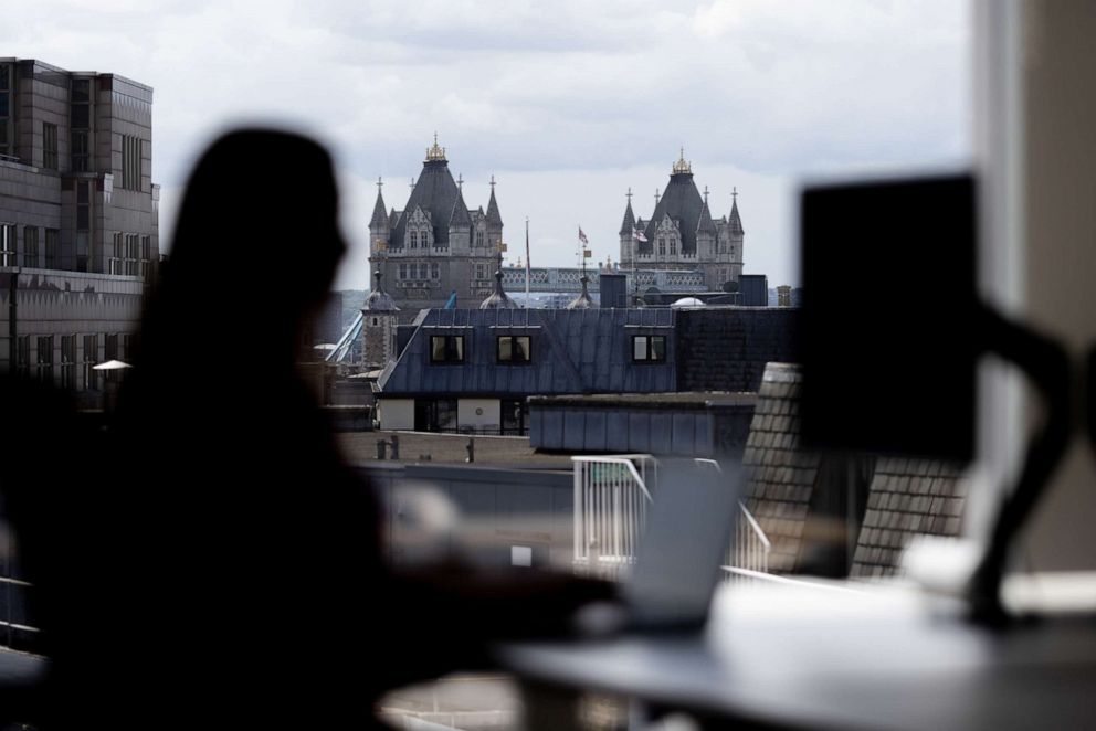 PHOTO: An office worker at a desk in London.