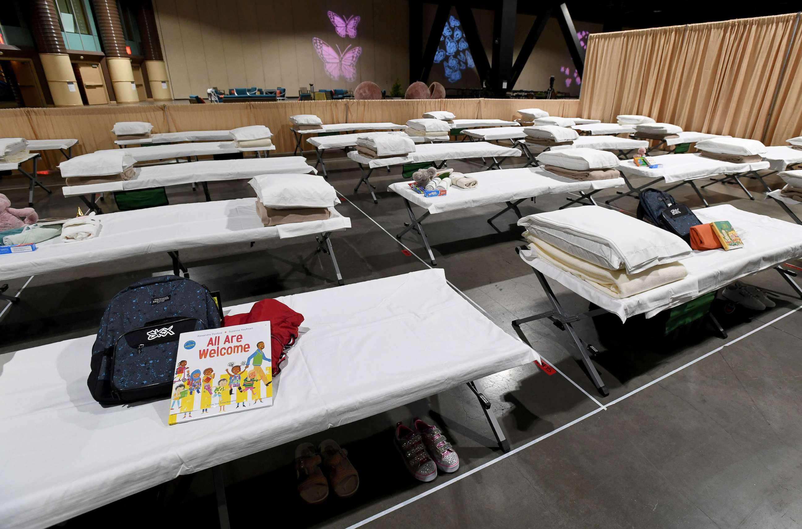 PHOTO:  Sleeping quarters set up inside Exhibit Hall B for migrant children are shown during a tour of the Long Beach Convention Center on April 22, 2021 in in Long Beach, Calif.