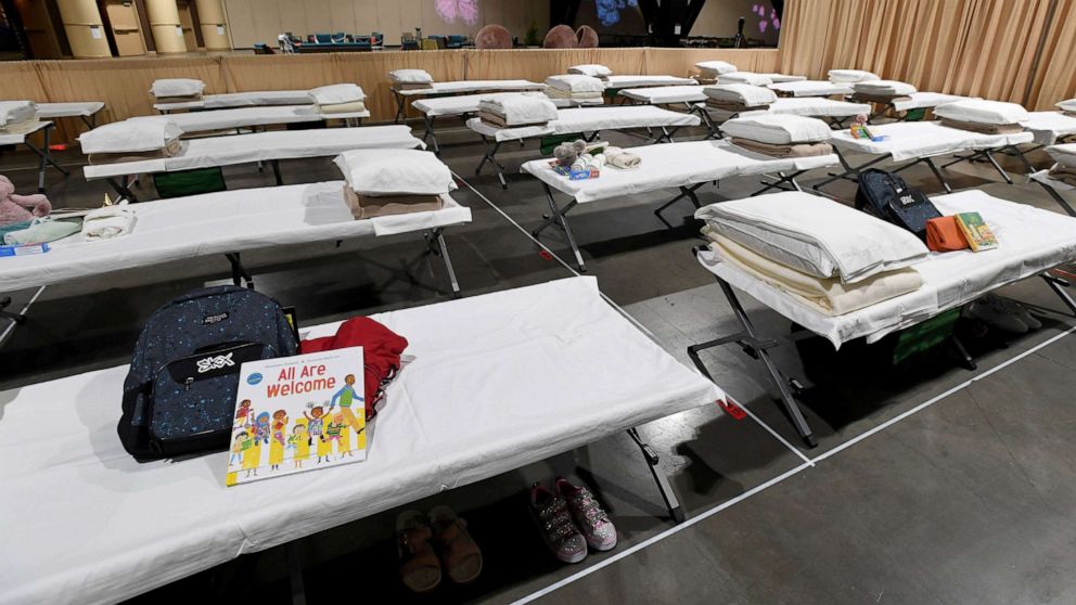 PHOTO:  Sleeping quarters set up inside Exhibit Hall B for migrant children are shown during a tour of the Long Beach Convention Center on April 22, 2021 in in Long Beach, Calif.