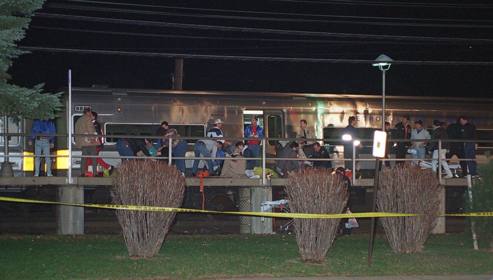 PHOTO: First responders work at the scene where a shooter opened fire on a Long Island Rail Road train stopped in Garden City, N.Y., Dec. 7, 1993.