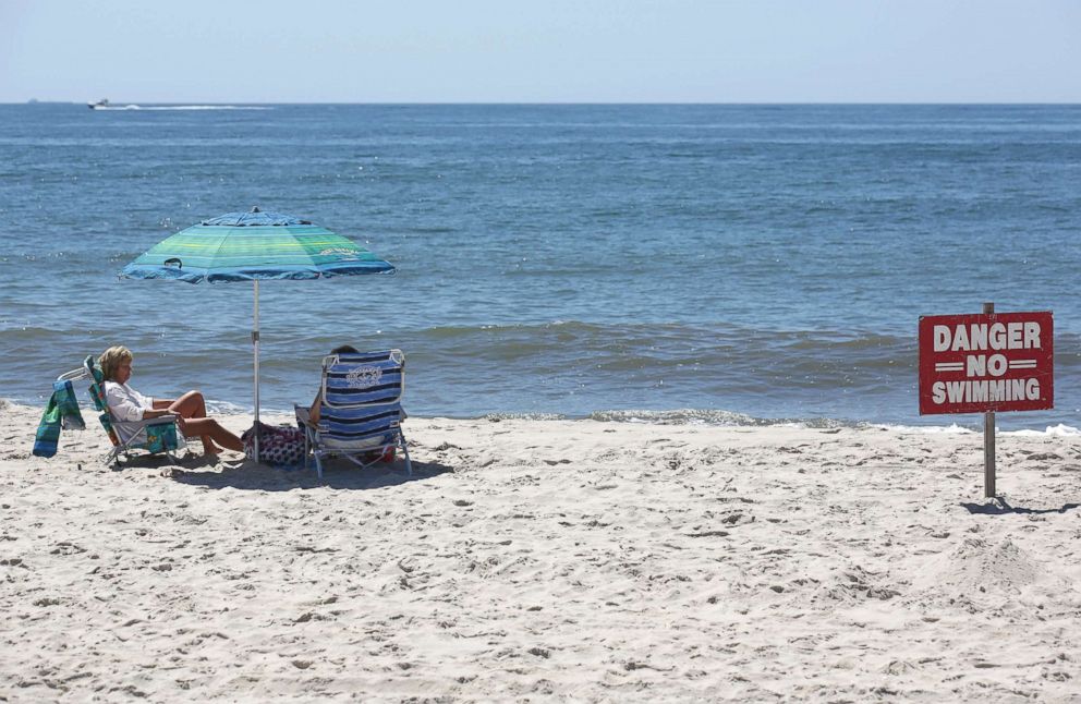 PHOTO: A "no swimming" sign is seen near Ocean Beach on Fire Island in Islip, N.Y., July 19, 2018.