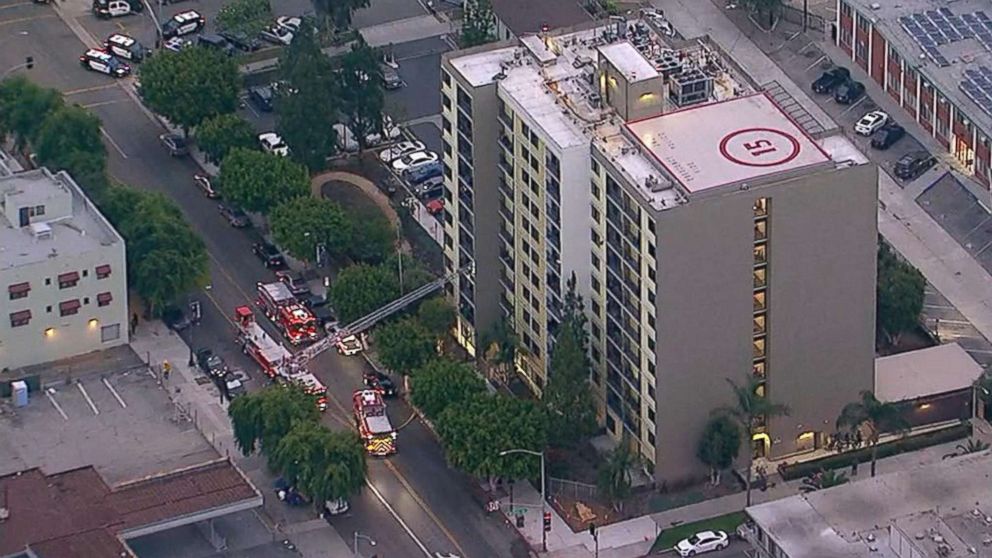Emergency personnel at the scene of a shooting at a Long Beach, California retirement home where two firefighters were shot when a gunman opened fire on them, June 25, 2018.