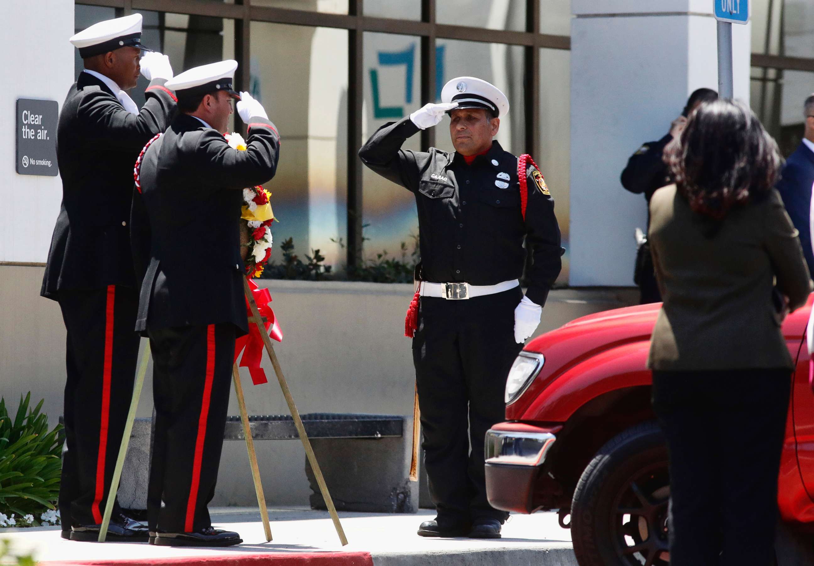 PHOTO: Long Beach firefighters salute for Fire Capt. Dave Rosa as they wait for his body to be transported from Saint Mary Medical Center in Long Beach, Calif., June 25, 2018.