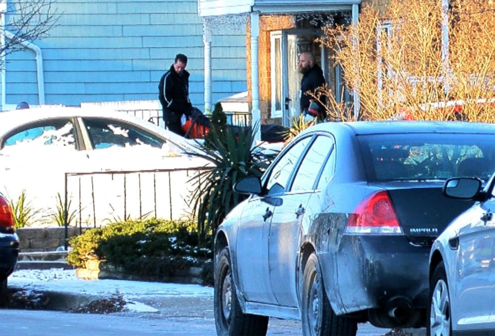 PHOTO: Investigators remove a body from the home in Long Branch, NJ, January 1, 2018, where a 16-year-old boy shot and killed 3 family members and a friend on New Year's Eve. 