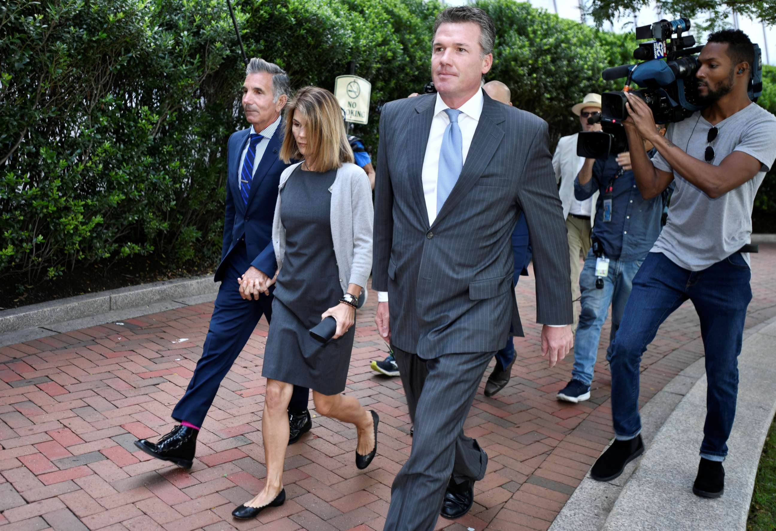 PHOTO: Actress Lori Loughlin and her husband, Mossimo Giannulli, arrive at the federal courthouse for a hearing on charges in a nationwide college admissions cheating scheme in Boston, Aug. 27, 2019.