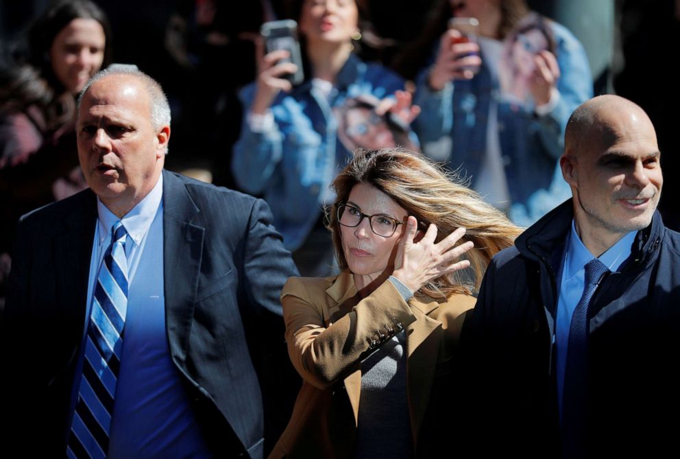 PHOTO: Actress Lori Loughlin, facing charges in a nationwide college admissions cheating scheme, is escorted to federal court in Boston, April 3, 2019.