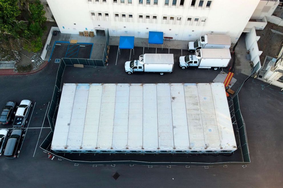 PHOTO: Refrigerated container trailers are parked in the Los Angeles County Coroner Department parking lot at the L.A. County Medical Center amid the COVID-19 pandemic, Jan 10, 2021, in Los Angeles.