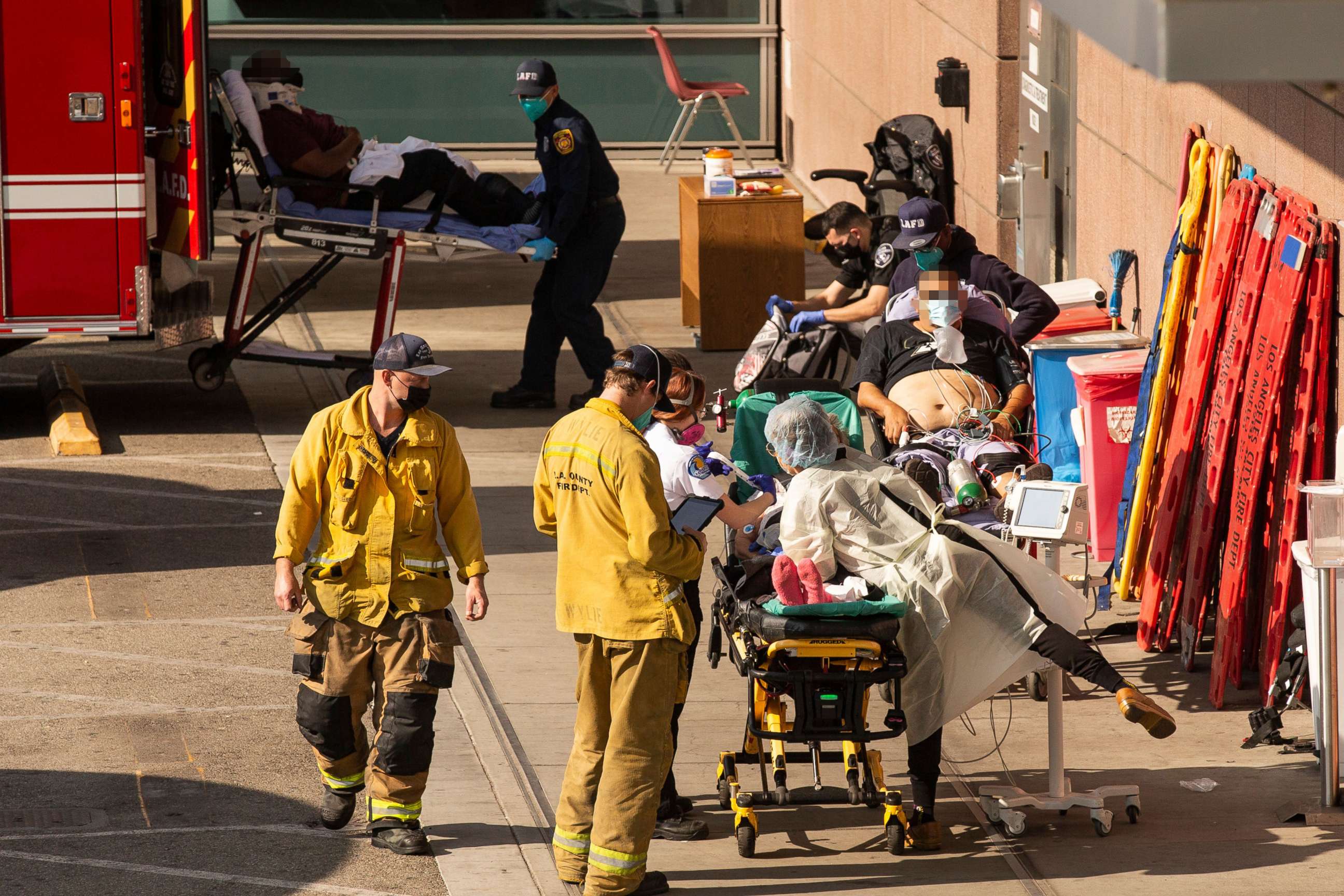 PHOTO: Patients brought in by ambulance wait outside the Emergency Room at the LAC USC Hospital ER amid the coronavirus pandemic in Los Angeles, Jan. 5, 2021.