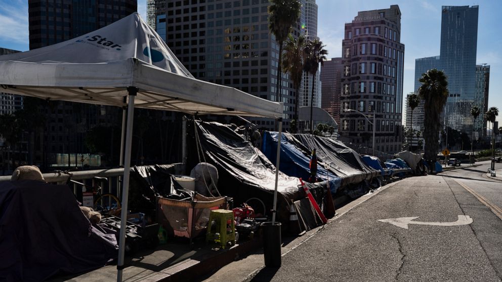 PHOTO: A homeless encampment is seen along a street in downtown Los Angeles next to the 110 freeway, Dec. 16, 2019.