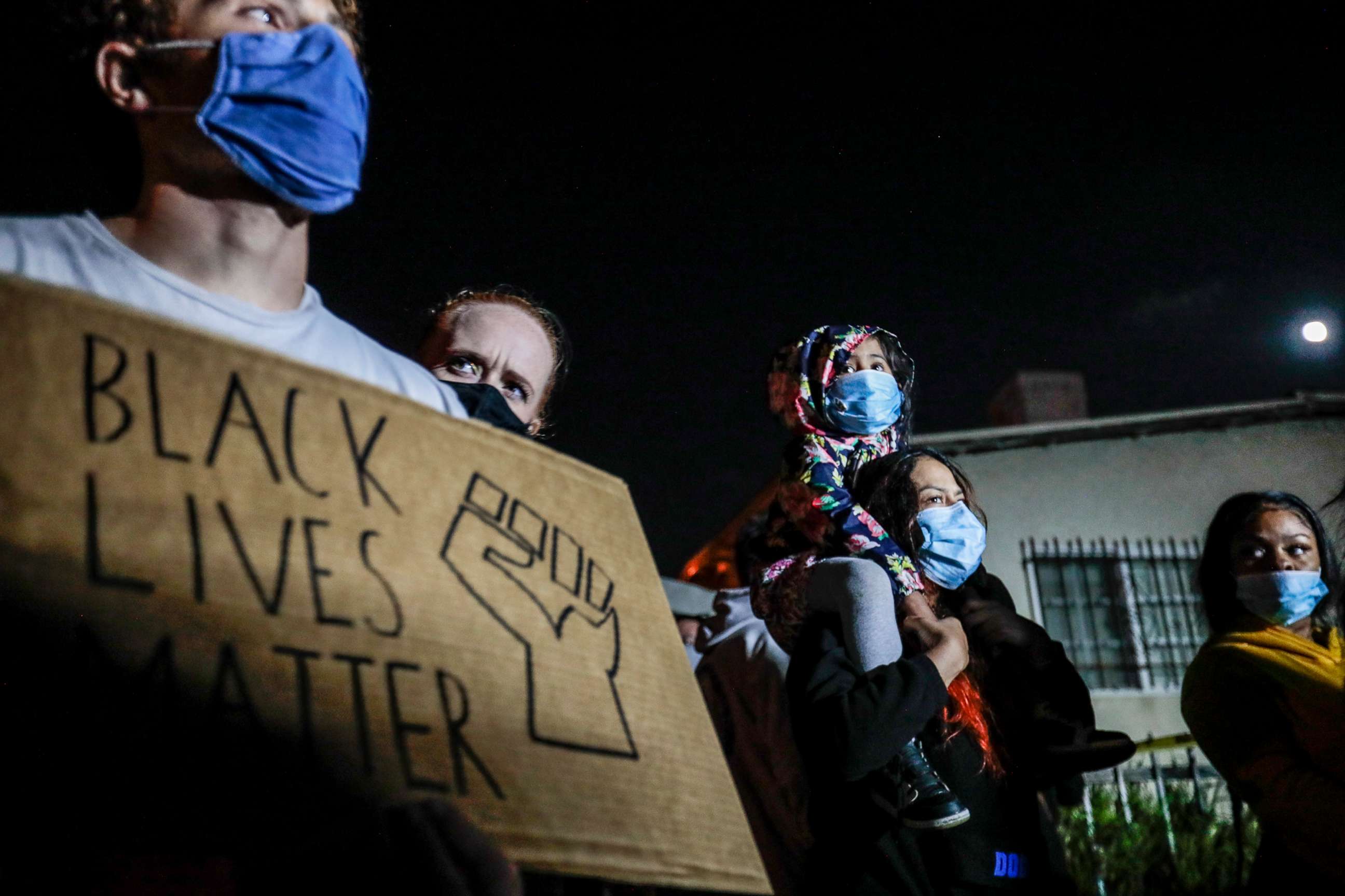 PHOTO: Gloria Gonzalez carries her daughter, Violet, 5, as protesters face off with Sheriff deputies hours after killing Dijon Kizzee, Aug. 31, 2020, Los Angeles.