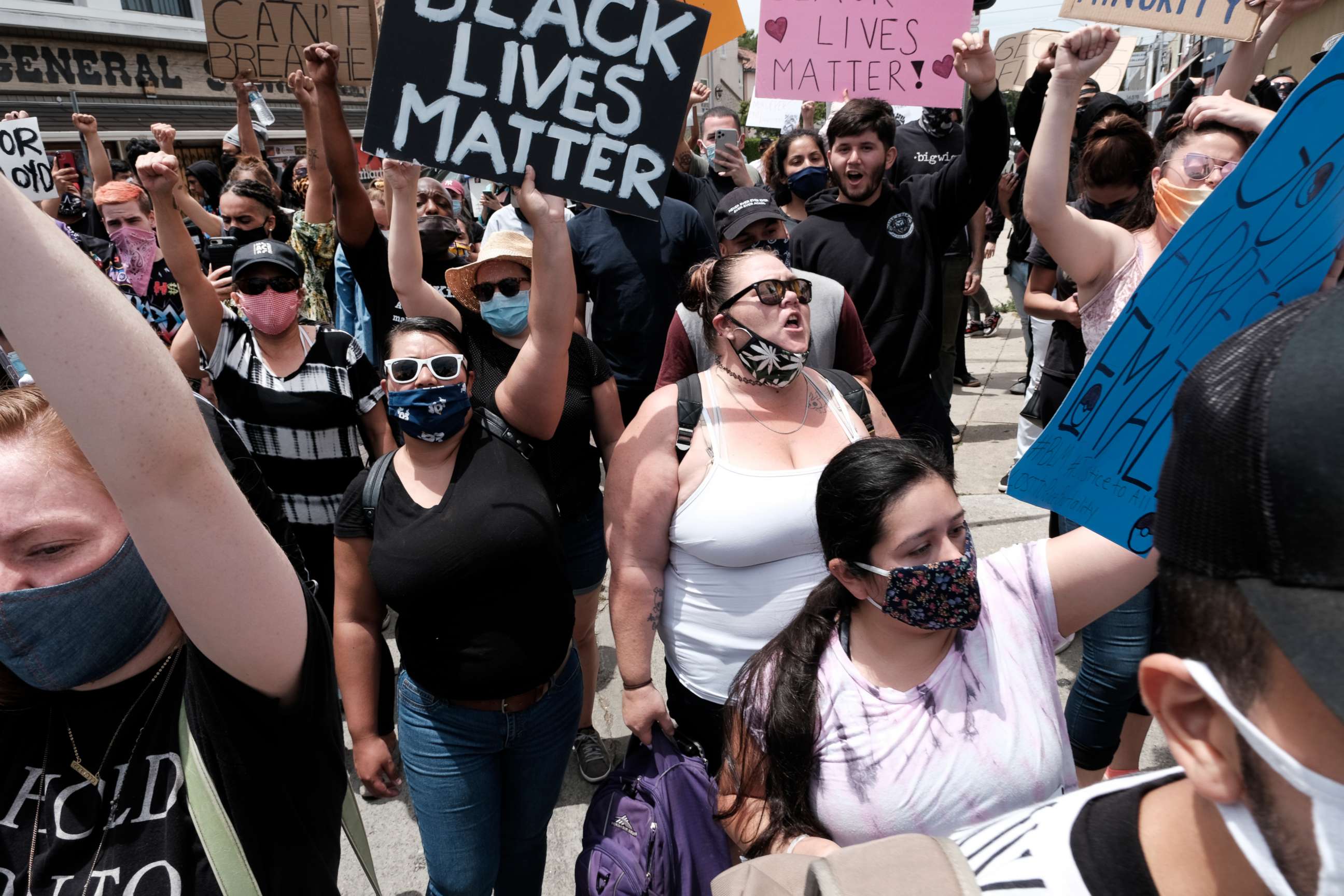PHOTO: Protesters chant and hold signs during a Black Lives Matter protest on a street corner in Los Angeles, Monday, June 1, 2020. Public health authorities are worried there could be a spike in coronavirus cases as thousands of people march in protests.