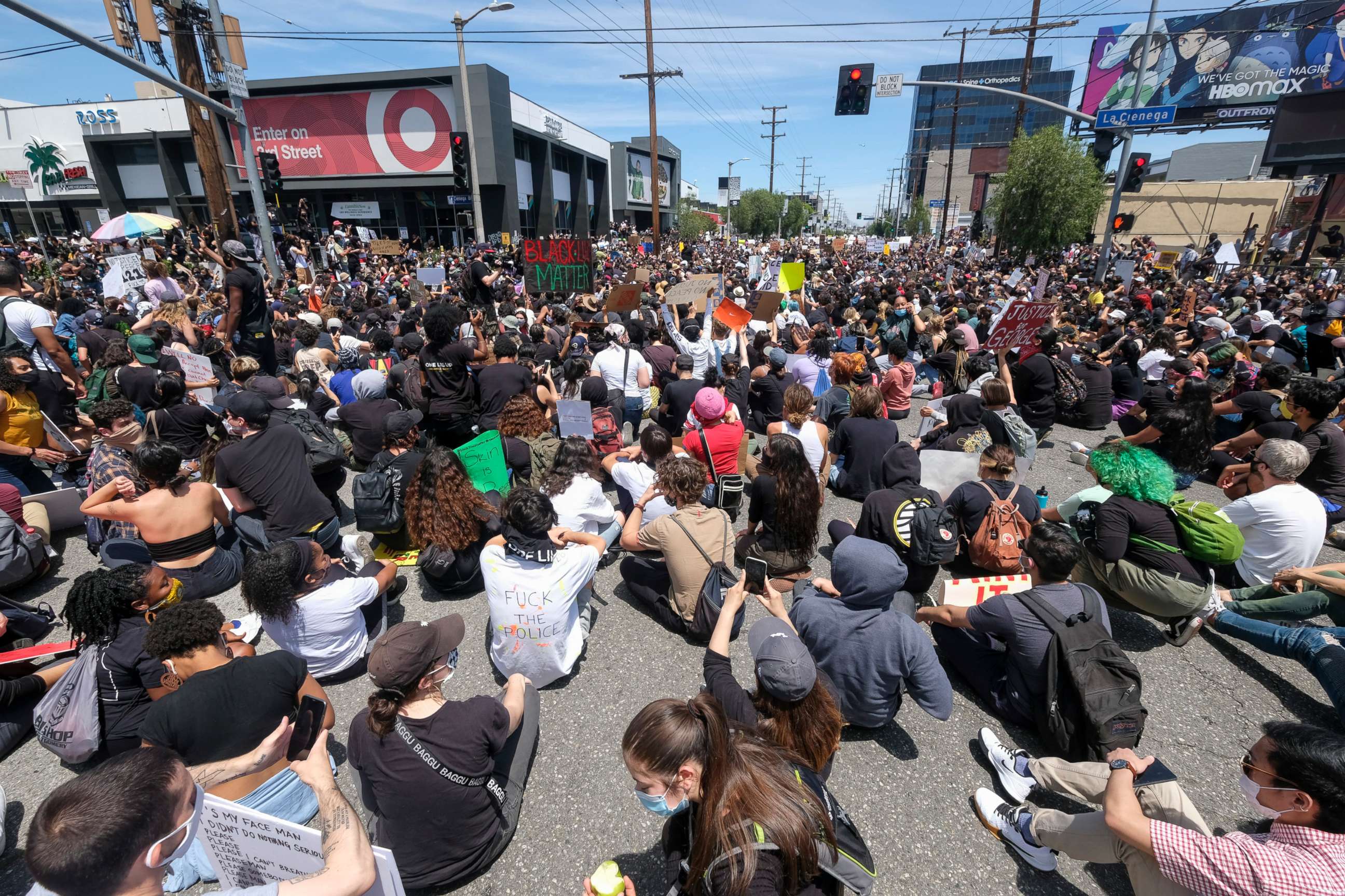 PHOTO: Peoples sit on at an intersection during a protest over the death of George Floyd in Los Angeles, May 30, 2020.