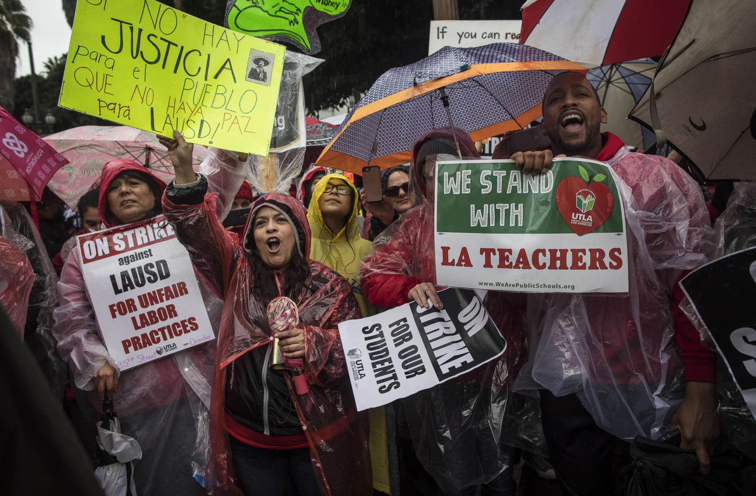 PHOTO: People rally in the streets of downtown in the pouring rain during a United Teachers Los Angeles strike on Jan. 14, 2019, in Los Angeles.