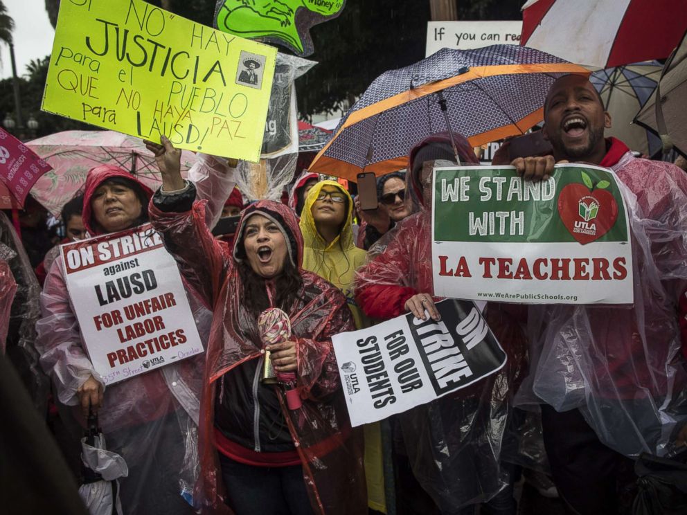 PHOTO: People rally in the streets of downtown in the pouring rain during a United Teachers Los Angeles strike on Jan. 14, 2019, in Los Angeles.