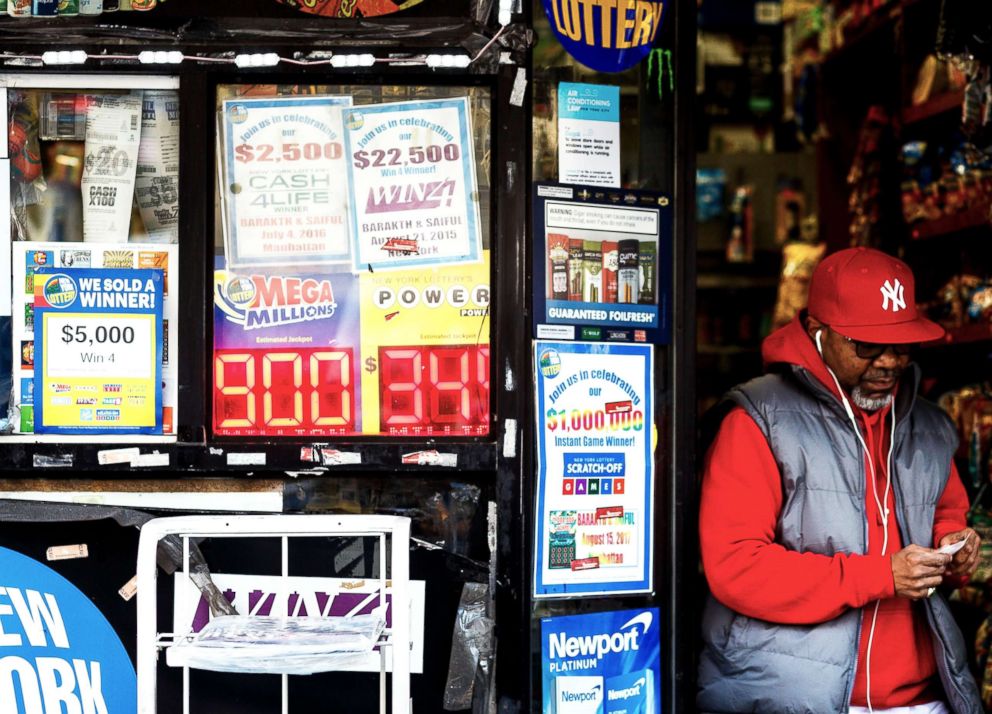 PHOTO: A view of a sign showing the jackpot for the Mega Millions lottery at $900 million (USD) in New York, New York, Oct.17, 2018.