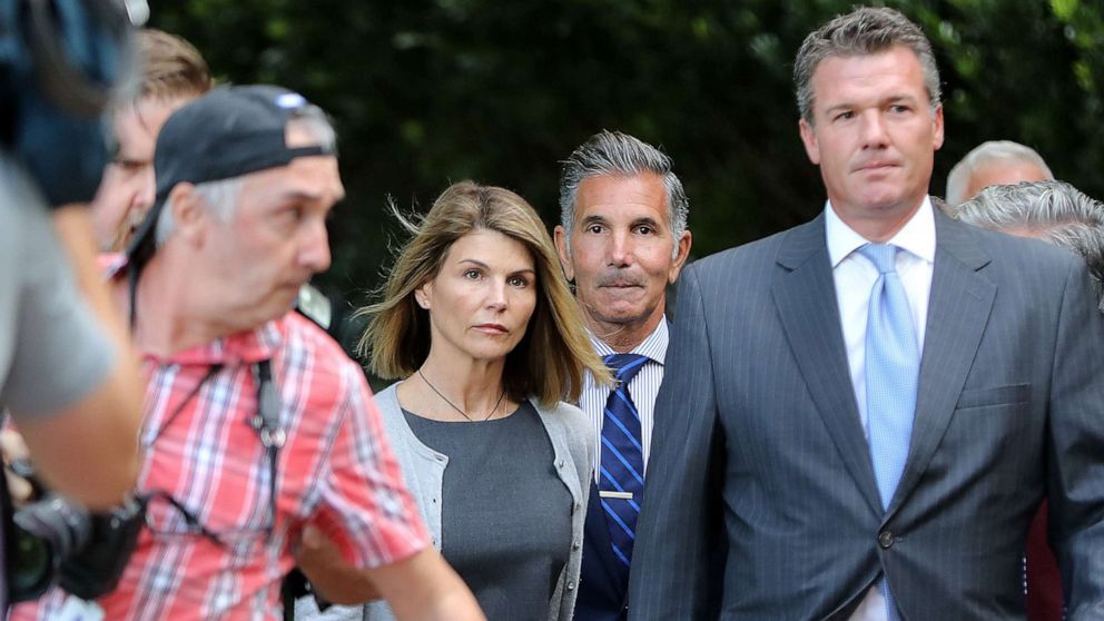 PHOTO: Lori Loughlin, center left, and her husband Mossimo Giannulli, center right, leave the John Joseph Moakley United States Courthouse in Boston, on Aug. 27, 2019. 