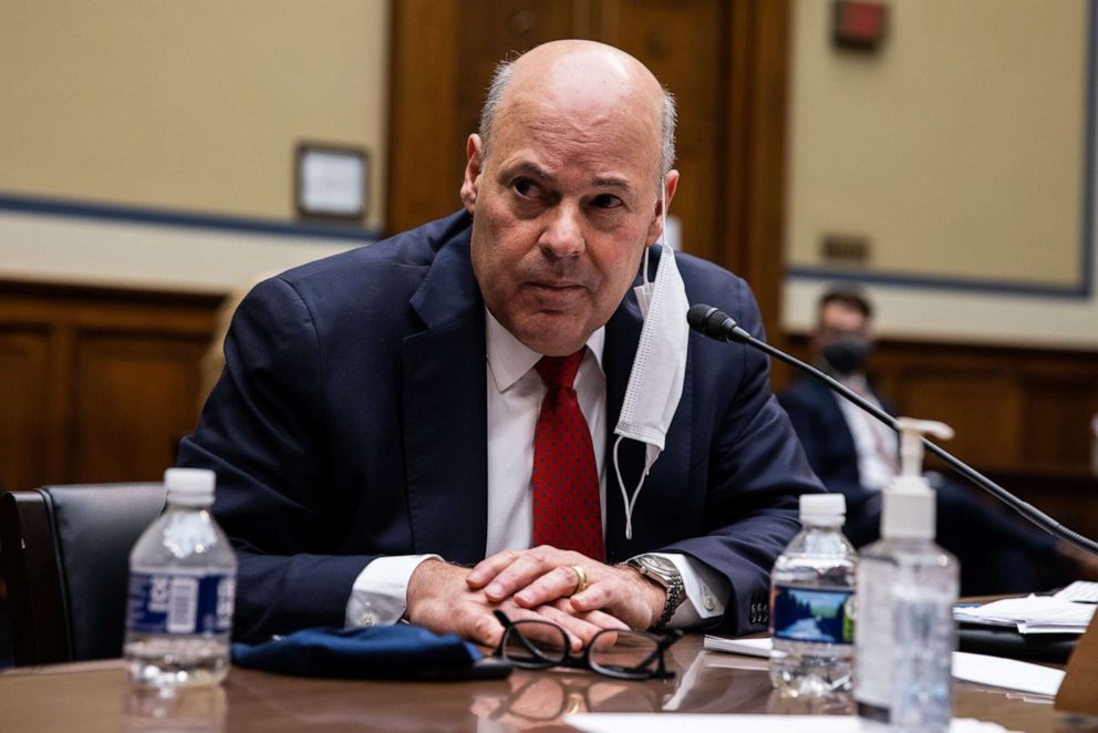 PHOTO: Louis DeJoy, postmaster general of the United States Postal Service, listens during a House Oversight and Reform Committee hearing in Washington, D.C., Feb. 24, 2021.