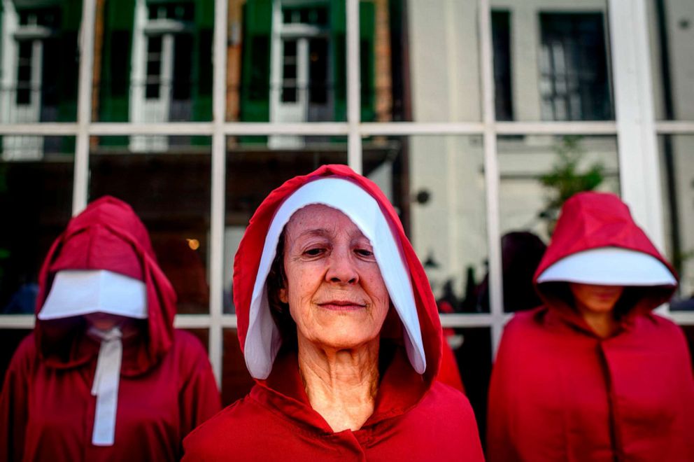 PHOTO: Protesters dressed as characters from the series The Handmaids Tale march in New Orleans on May 25, 2019, to protest the proposed Louisiana Heartbeat Bill.