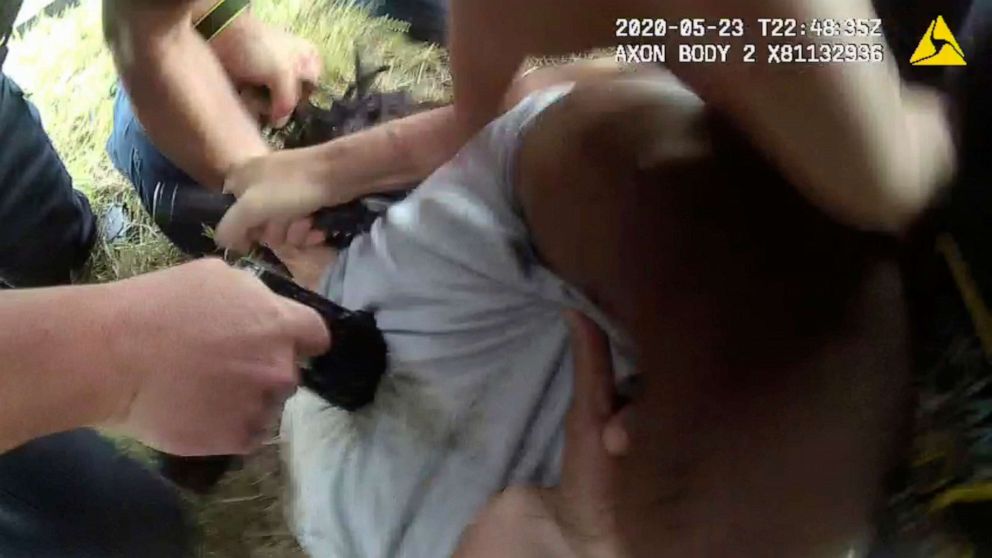 PHOTO: In this May 23, 2020 image from Louisiana State Police body camera video, an  officer applies an electric weapon to the back of Black motorist Antonio Harris as other officers restrain him after a high speed chase in Franklin Parish, La.