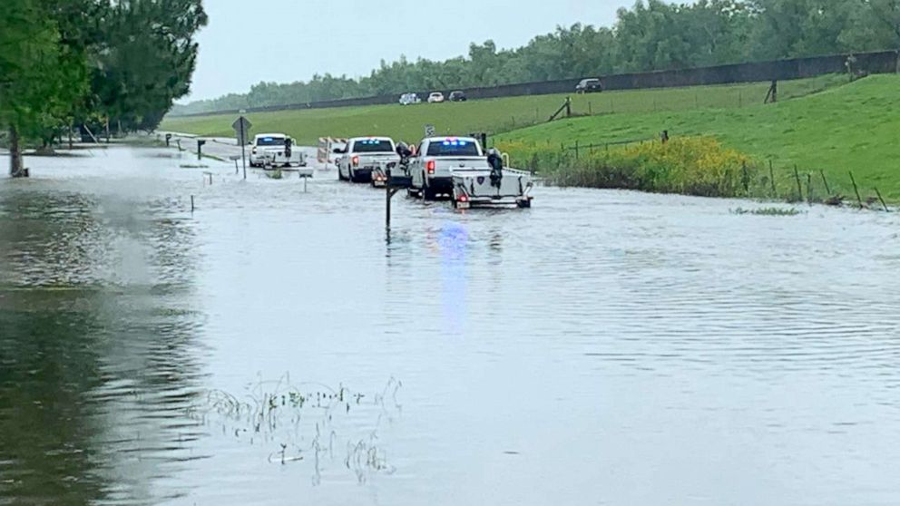 PHOTO: Officers from the Louisiana Office of State Fire Marshal respond to flooding in the Bayou Pigeon area of Iberville parish in Louisiana, May 21, 2021.