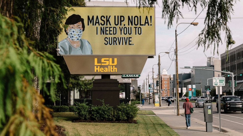 PHOTO: An electronic message board displays a rendering of New Orleans Mayor Latoya Cantrell wearing a face mask, along with a message to mask up, at the Louisiana State University Medical Center in New Orleans, July 28, 2020.