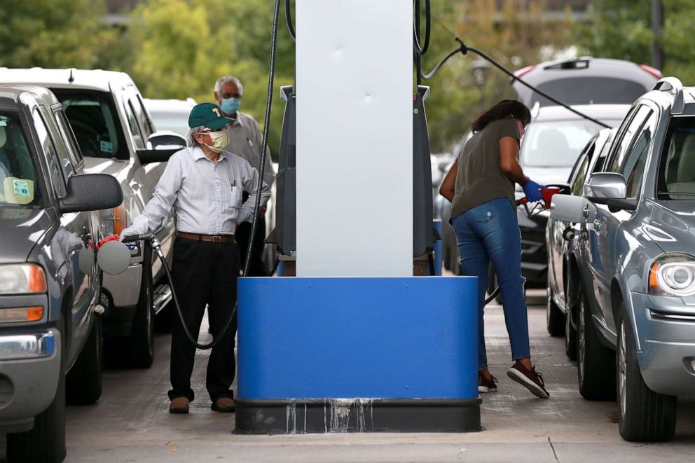 PHOTO: People wait in long lines for gas at Costo as they prepare for Hurricane Marco and Tropical Storm Laura, Aug. 23, 2020, in New Orleans.