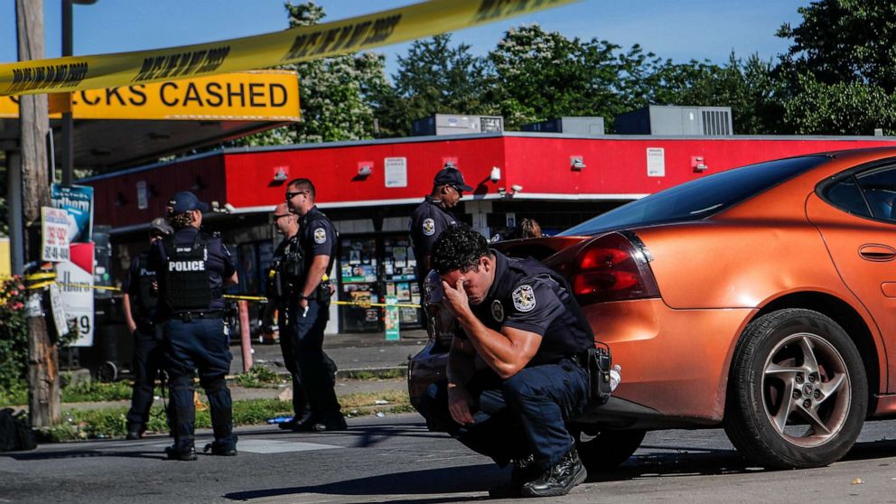 PHOTO: Louisville police stand guard at the intersection of 26th and Broadway on June 1, 2020, in Louisville, Ky., after a man was shot and killed by police and National Guard personnel outside Dino's Market.