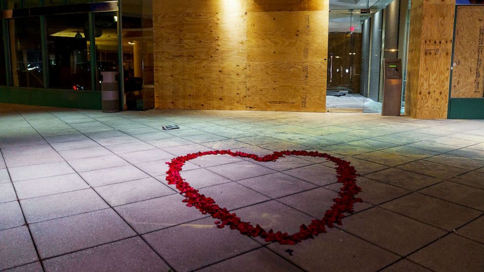 PHOTO: Rose petals lay at the entrance of the Old National Bank on April 11, 2023 in Louisville, Ky.