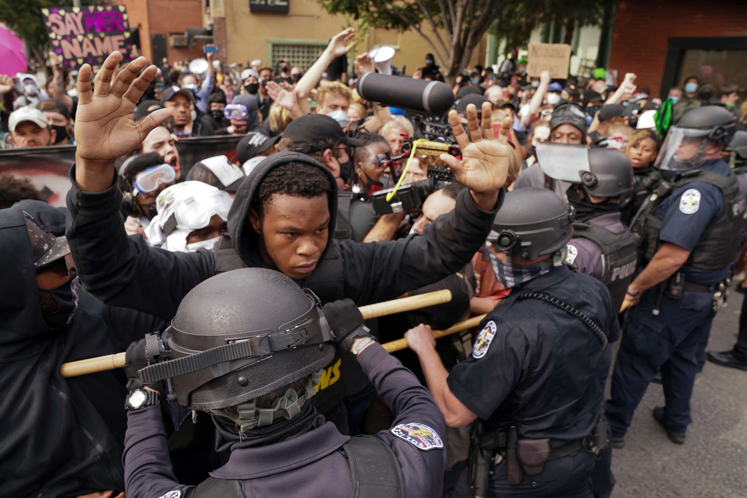 PHOTO: Police and protesters converge during a demonstration, Wednesday, Sept. 23, 2020, in Louisville, Ky. 