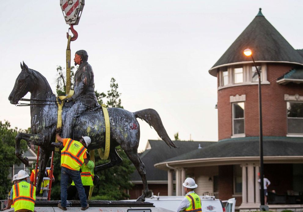 PHOTO: The John B. Castleman statue, in Louisville's Cherokee Triangle neighborhood, is removed from its pedestal where it has stood for over 100 years, in Lousville, Ky.