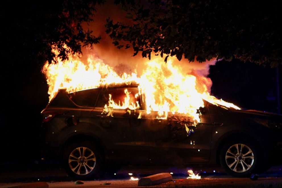 PHOTO: A car is lit on fire during unrest in Louisville, Kentucky, Sept. 26, 2020.