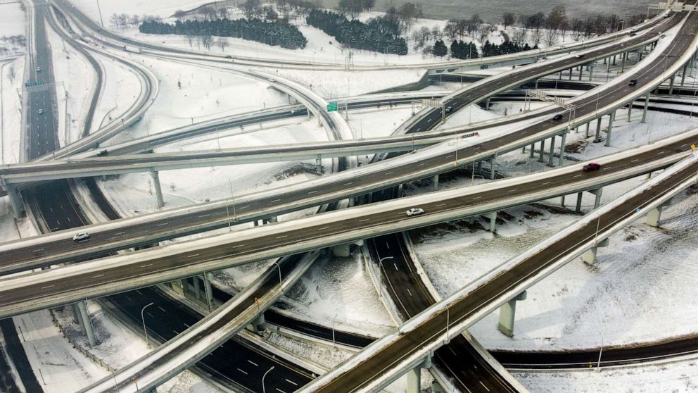 PHOTO: Vehicles move along a highway in Louisville, Kentucky, under freezing temperatures on December 23, 2022.