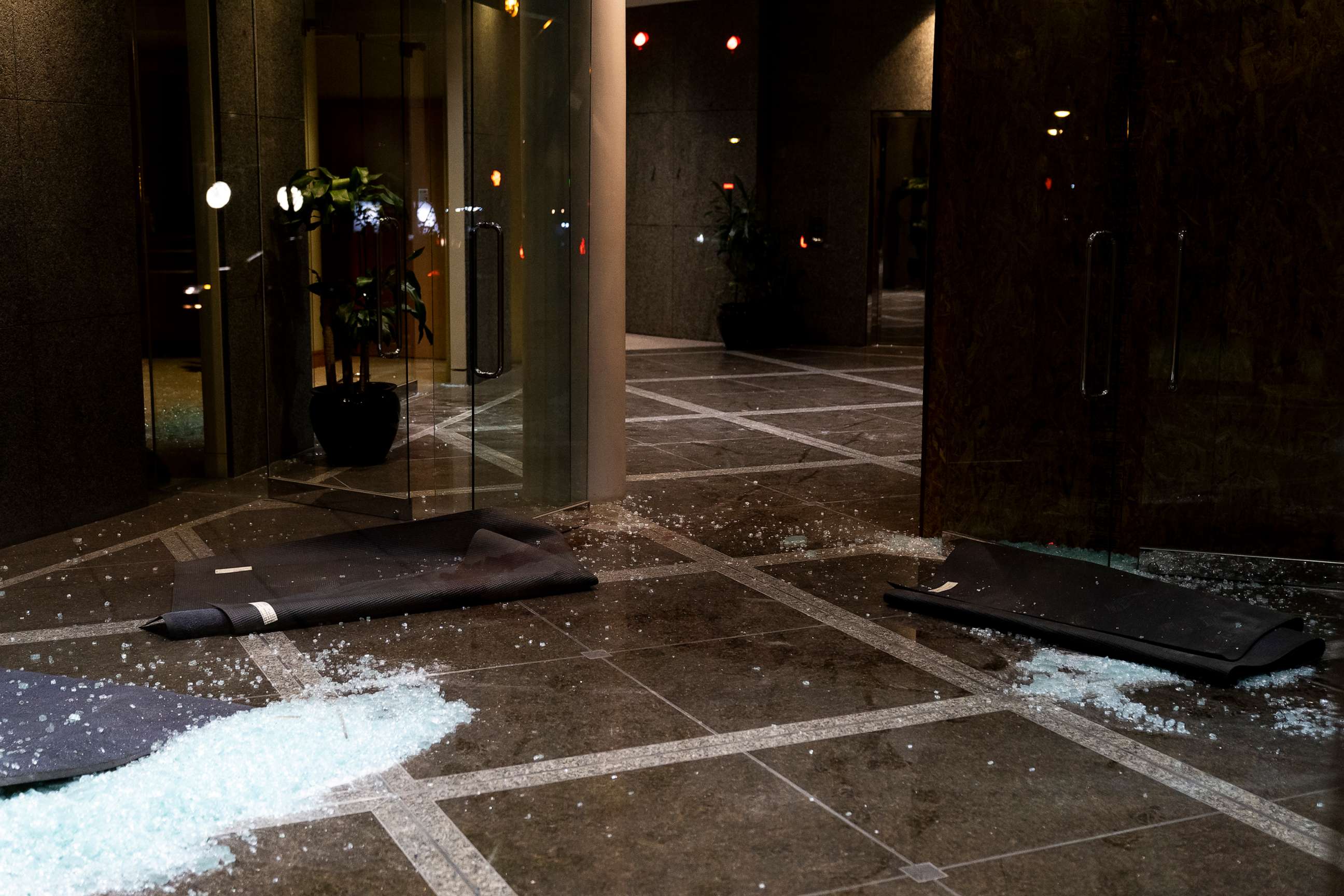 PHOTO: Broken glass remains on the floor at the Old National Bank on April 10, 2023 in Louisville, Ky.