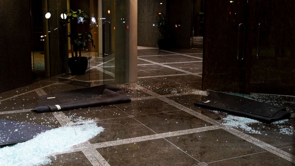 PHOTO: Broken glass remains on the floor at the Old National Bank on April 10, 2023 in Louisville, Ky.