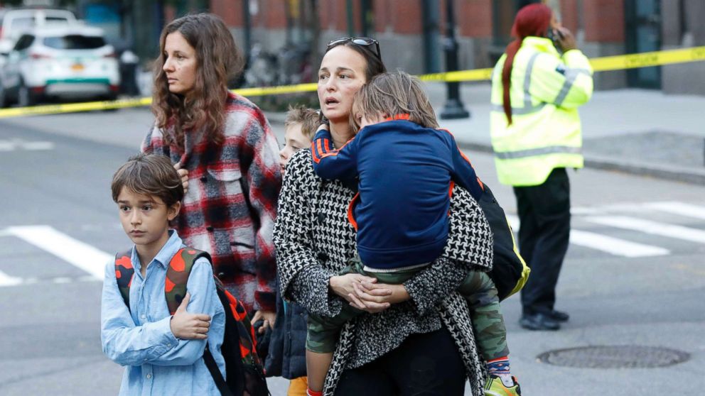 PHOTO: Parents pick up their children from P.S./I.S.-89 school after a shooting incident in New York City, Oct. 31, 2017.