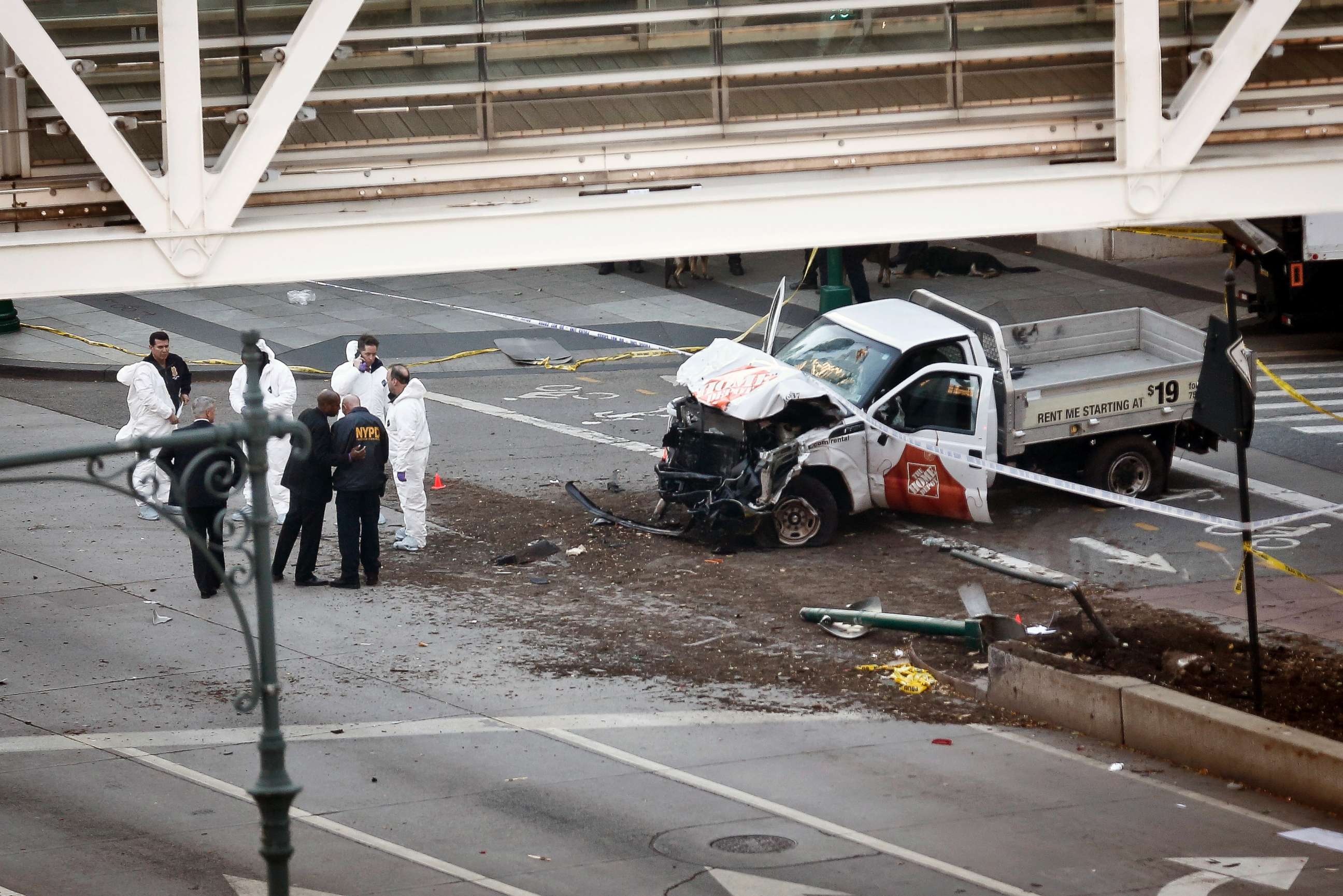 PHOTO: Authorities stand near a damaged Home Depot truck after a motorist drove onto a bike path near the World Trade Center memorial, striking and killing several people, Oct. 31, 2017, in New York.