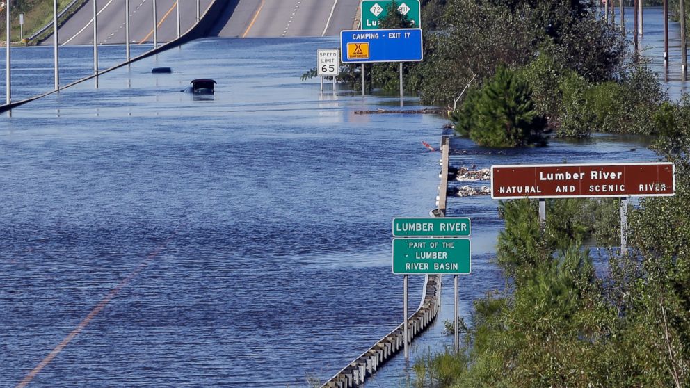 PHOTO: The Lumber River overflows onto a stretch Interstate 95 in Lumberton, N.C., Tuesday, Sept. 18, 2018, following flooding from Hurricane Florence.