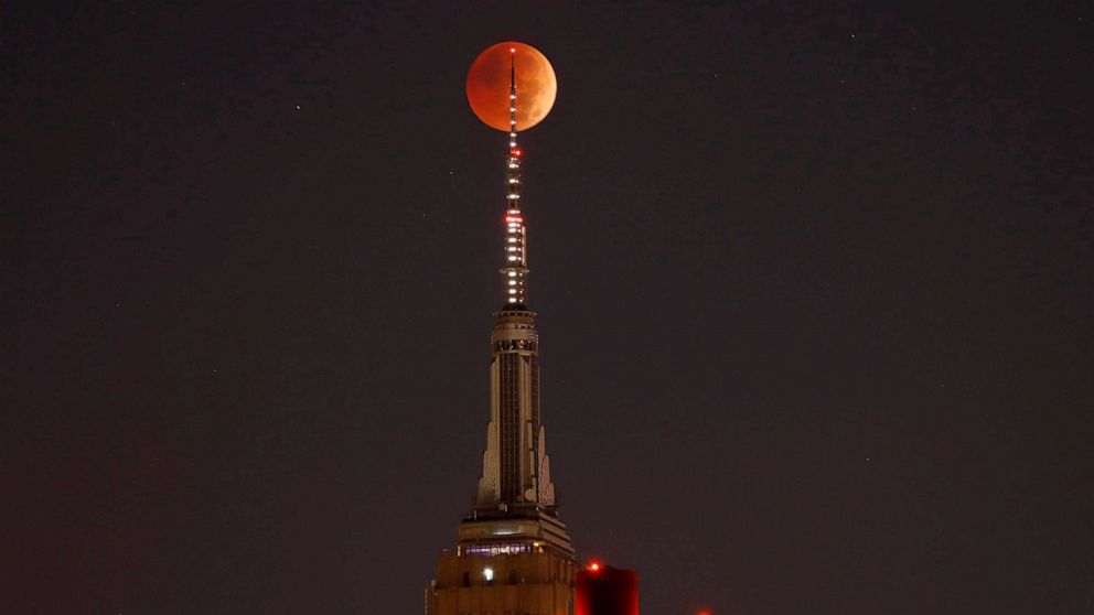 PHOTO: FILE - The blood-red full Beaver Moon passes behind the Empire State Building during a total lunar eclipse, Nov. 8, 2022, in New York City.