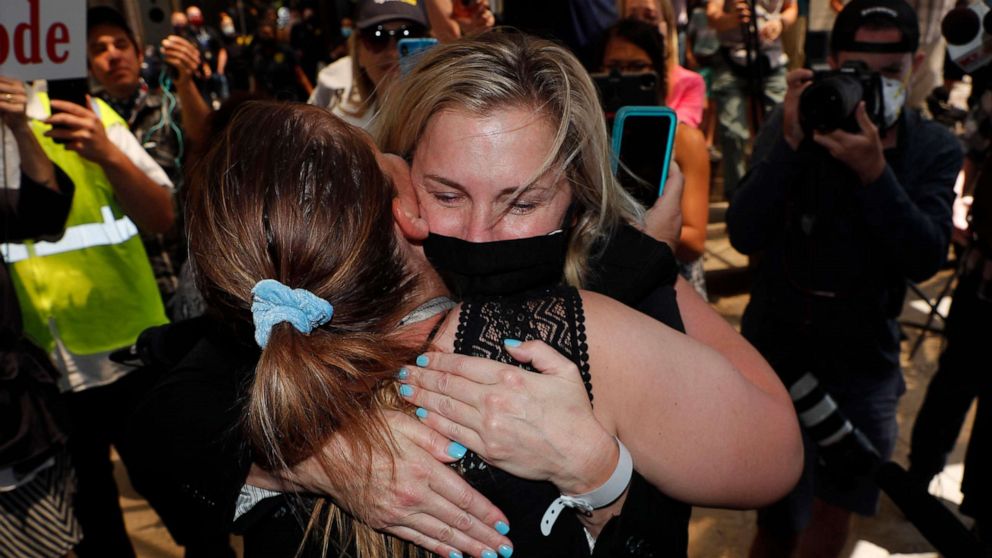 PHOTO: Salon owner Shelley Luther hugs a supporter after she was released from jail in Dallas, May 7, 2020. 