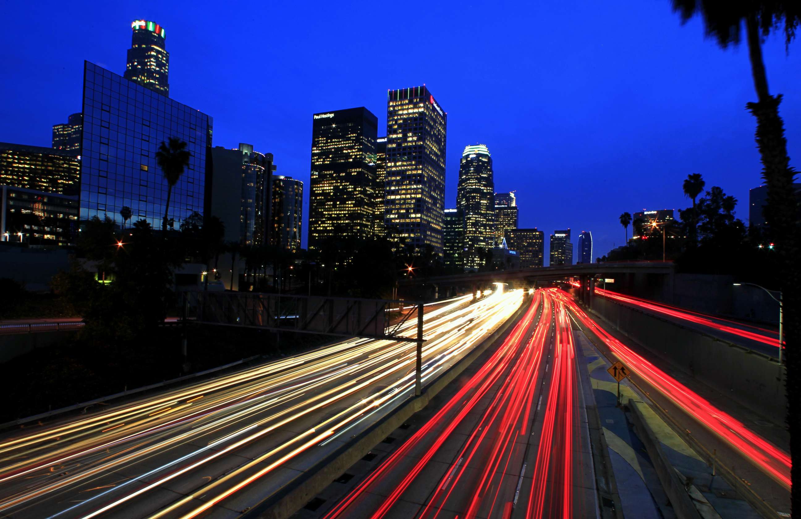 PHOTO: A long exposure shows motorists commuting during the evening rush hour on the 110 Freeway in downtown Los Angeles, December 2014.  