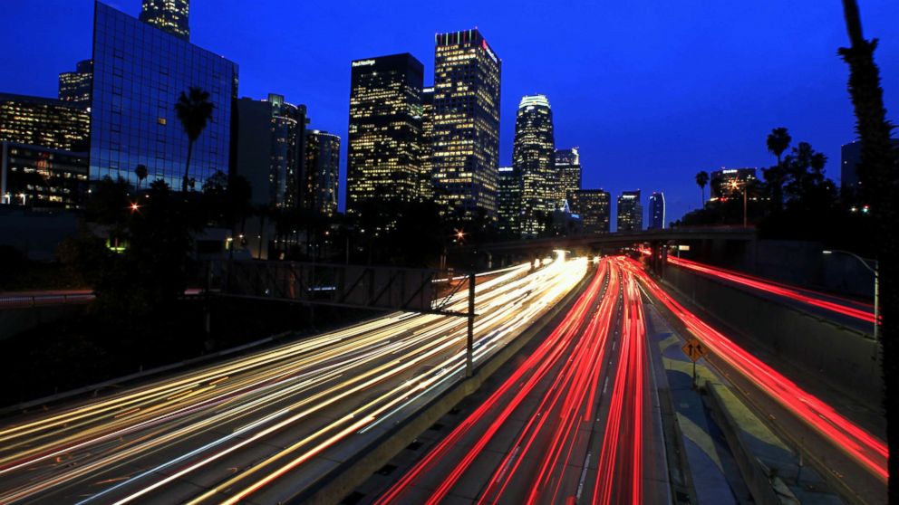 A long exposure shows motorists commuting during the evening rush hour on the 110 Freeway in downtown Los Angeles, December 2014.    