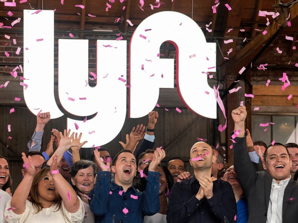 PHOTO: In this Friday, March 29, 2019 file photo, Lyft co-founders John Zimmer, front second from left, and Logan Green, front second from right, cheer as they as they ring a ceremonial opening bell in Los Angeles, to mark trading on the Nasdaq exchange.