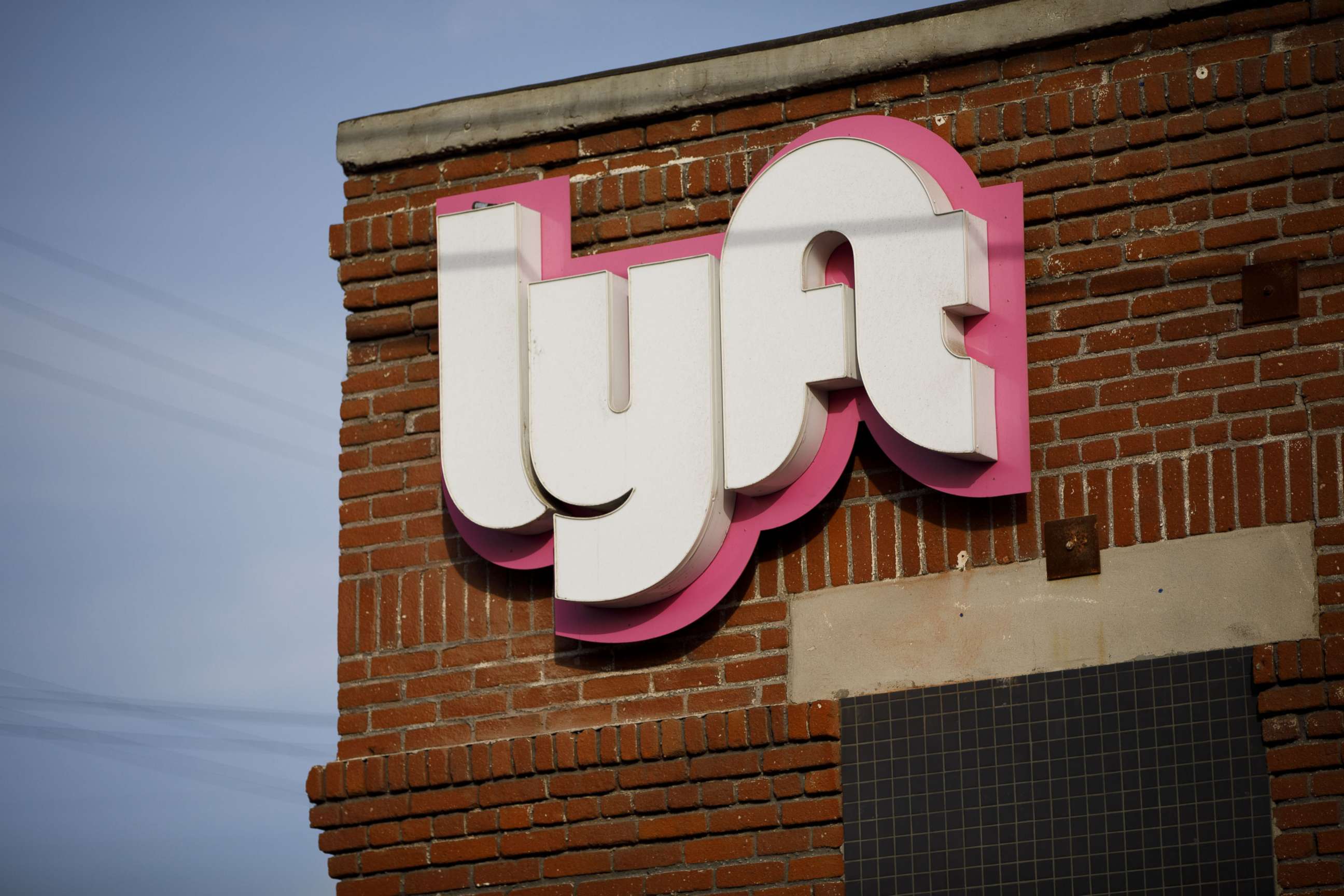 PHOTO: Signage is displayed outside of the Lyft Inc. driver hub in Los Angeles, Nov. 13, 2017.