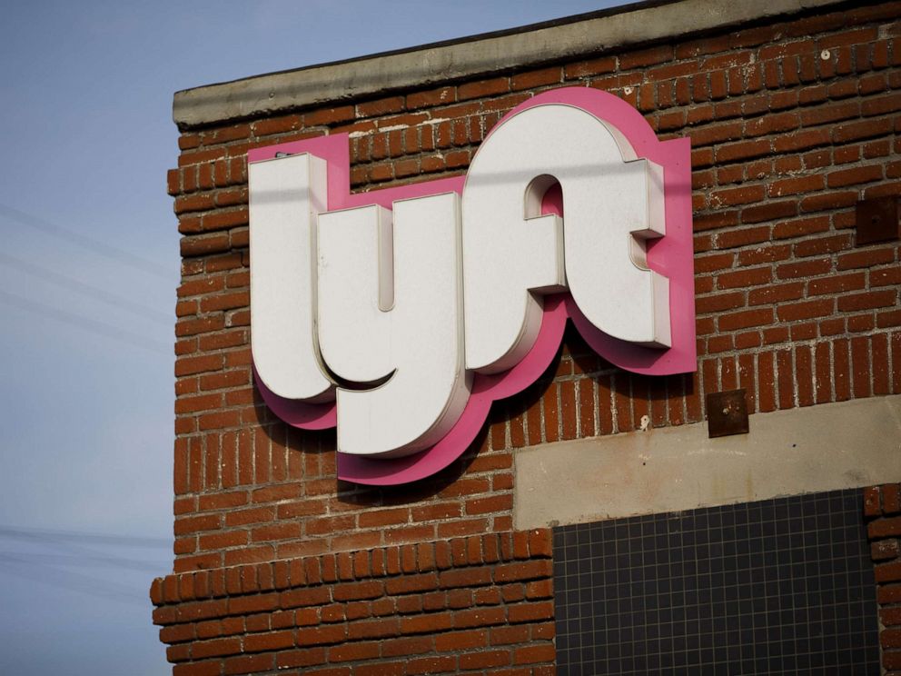 PHOTO: Signage is displayed outside of the Lyft Inc. driver hub in Los Angeles, Nov. 13, 2017.