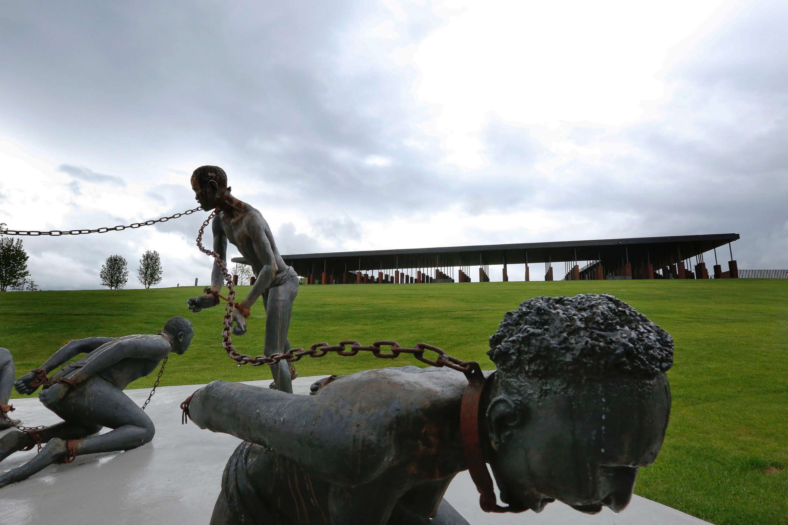 PHOTO: A statue depicting chained people on display at the National Memorial for Peace and Justice, a new memorial to honor thousands of people killed in racist lynchings, April 22, 2018, in Montgomery, Ala.